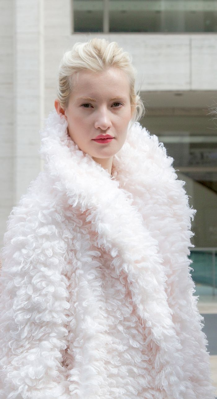 Mastering the First Impression: Your intriguing post title goes here Elegant portrait of a young woman in a fashionable white fur coat, exuding luxury and style.